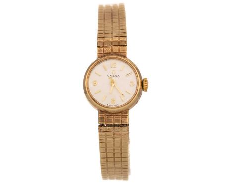 OMEGA NINE CARAT GOLD MANUAL WIND WRIST WATCH,  the round dial with baton hour markers, in nine carat gold, in box, with book