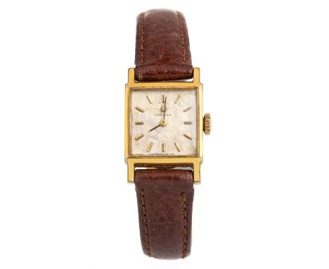 OMEGA GOLD PLATED MANUAL WIND WRIST WATCH,  the rectangular dial with baton hour markers, 16mm case, on a brown leather strap