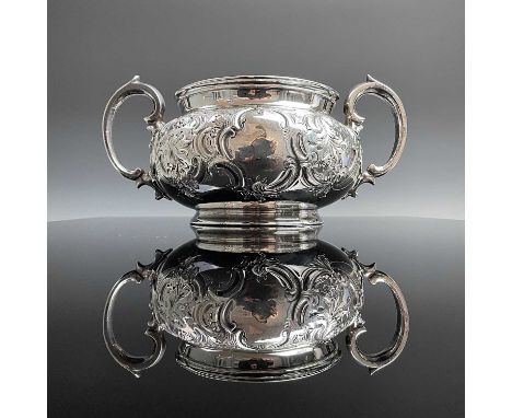 An early Victorian silver twin handled sugar bowl by Harrison Brothers &amp; Howson, the ovoid body foliate C scroll embossed