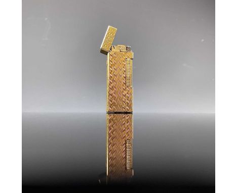 A Dunhill gold plated engine turned lighter.