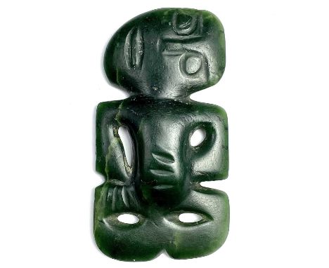 An extremely rare Maori human form hei-tiki pendant, green nephrite jade, possibly pounamu, the head tilted right, the left h