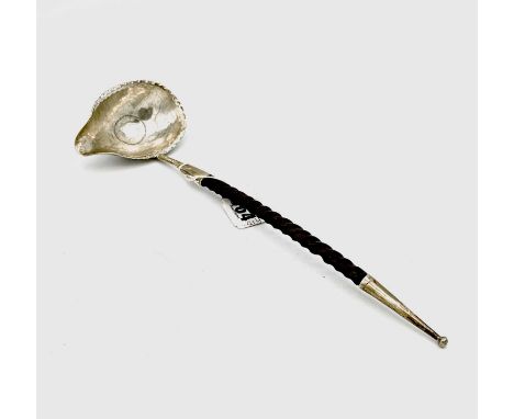 A Victorian silver toddy ladle with twisted baleen handle and silver finial, the bowl set with a William IV sixpence, maker E