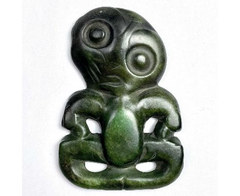 A rare Maori anthropomorphic hei-tiki pendant, green nephrite jade, possibly pounamu, the head tilted right, evidence of susp