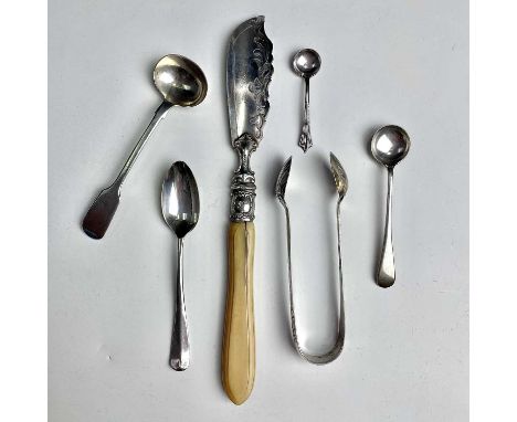 A Victorian silver butter knife with ivory handle, Sheffield 1869; together with four spoons and a pair of tongs, weight of s