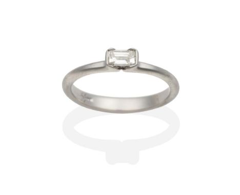 A Platinum Solitaire Diamond Ring, an octagonal cut diamond in a half rubbed over setting, estimated diamond weight 0.30 cara