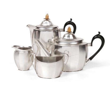 A Four Piece Silver Tea Service of George III Style, Roberts & Belk, Sheffield 1925, faceted oval form, the teapot and hot wa