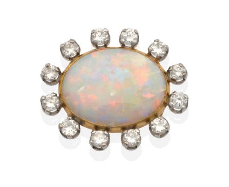 An 18 Carat Gold Opal and Diamond Cluster Pendant, an oval cabochon opal in a milgrain closed back setting within a border of