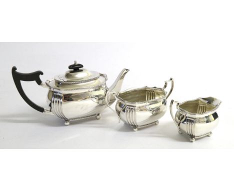 A Three Piece Silver Tea Service, Edward Barnard & Sons Ltd London 1918, shaped oval with gadroon border, the teapot 14.5cm h