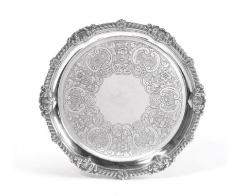 A George III Silver Salver, Paul Storr, London 1815, with gadroon and foliate shell border, on three foliate bracket feet, th