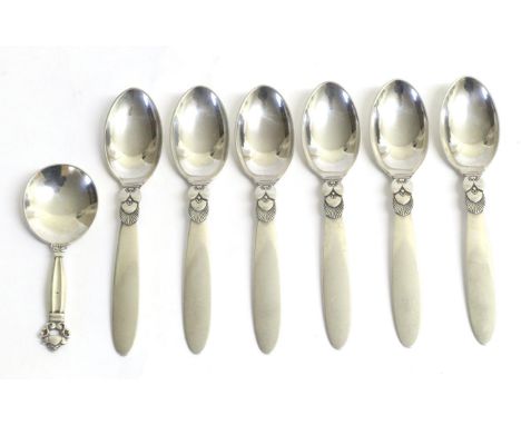 A Set of Six George Jensen Silver Catus Pattern Dessert Spoons, post 1945 mark, stamped Sterling Denmark, and A George Jensen