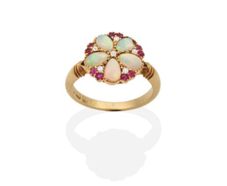 An 18 Carat Gold Opal Ruby and Diamond Cluster Ring, a circular top inset with five pear cut opals, spaced by round cut rubie