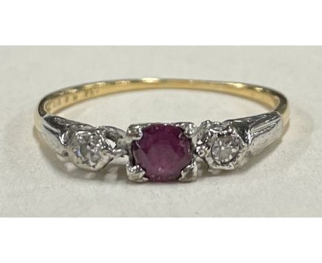 A small Antique ruby and diamond three stone ring in 18 carat mount. Approx. 2 grams. Est. £60 - £80.