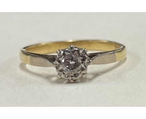 A small diamond single stone ring in 18 carat gold claw mount. Approx. 2.7 grams. Est. £40 - £60.