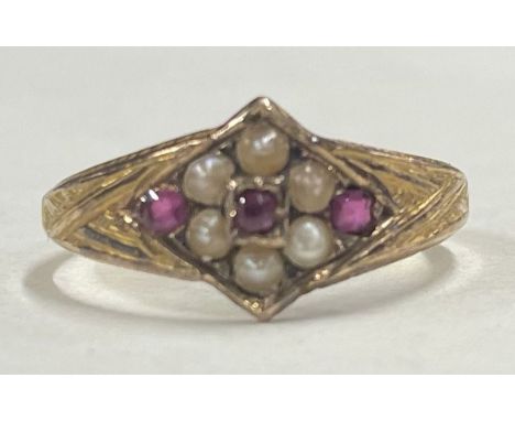 A ruby and pearl cluster ring in 15 carat gold setting. Approx. 2 grams. Est. £50 - £80.