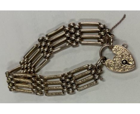 A good 9 carat gate bracelet with frosted links and chased padlock. Approx. 19 grams. Est. £280 - £320.