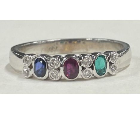 A heavy ruby, emerald, sapphire and diamond cluster ring in 18 carat white gold. Approx. 3.8 grams. Est. £100 - £150.