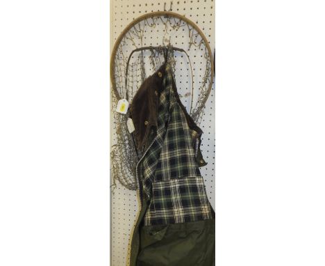 A collection of two vintage fisherman's nets comprising a bent ash teardrop shaped trout net and a spring steel trout net, bo