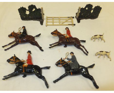 A collection of Britain's hunting figures to include two ladies riding side-saddle, two huntsmen on horseback, two hounds, an