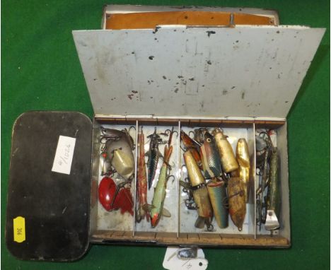 An Army & Navy Co. japanned lidded fly case and a Spintak spinner case with compartmented interior containing a good selectio