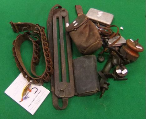 A box containing various game and fishing equipment to include vintage game carrier, leather fly wallet, shot bag, two wooden