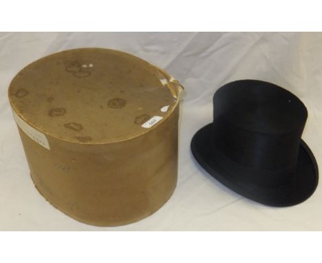 A black silk top hat by Davis Limited, initialled inside "AG", housed in a cardboard hat box CONDITION REPORTS Top Hat - size