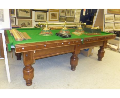 A mahogany slate bed half size billiard table bearing ivorine plaque with indistinct inscription, together with various acces