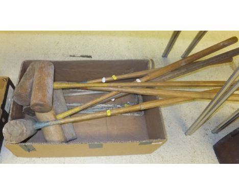 A vintage uncased croquet set containing various mallets hoops 