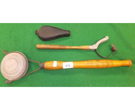 A hand-held clay thrower with turned wood handle, another smaller hand-held clay thrower, and a black leather powder flask