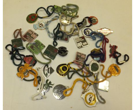 A collection of 28 various enamel race badges