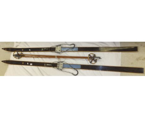 A set of vintage Oslo cross country skiis and Sparta bamboo poles