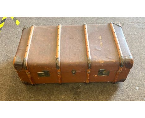 Wooden bound travel trunk, which measures approximately 36 inches in width, 20 inches in depth and 14 inches in height 
