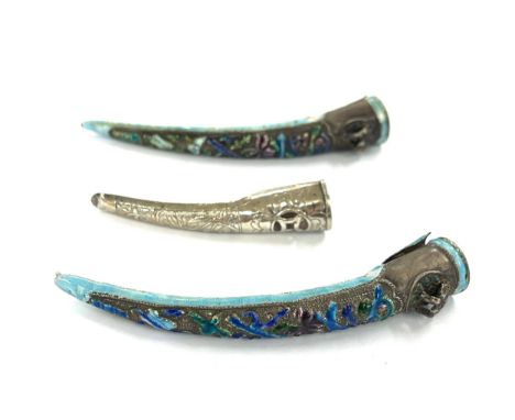 Two Chinese silver and enamel finger guards and one other 