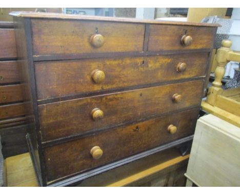 A Victorian oak chest of two short and three long drawers, standing on bracket shaped feet, 35 1/4"h x 41 1/2"w 