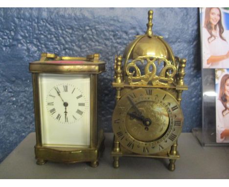 An early 20th century brass carriage clock, together with a Smiths 8 day clock in the form of a lantern clock 