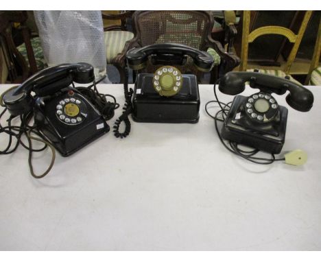 Three vintage metal and Bakelite telephones 