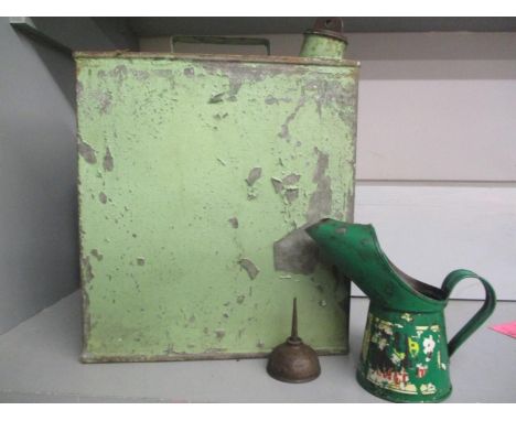 A vintage petrol can together with two oil cans 