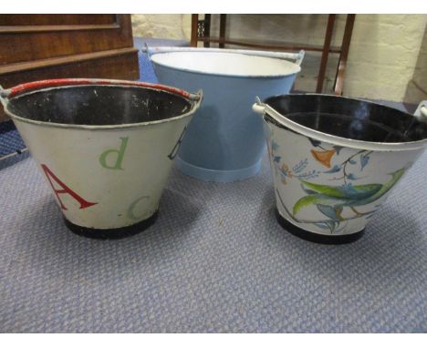 Three painted vintage buckets, one originally a fire bucket 