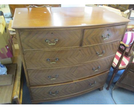 A late 19th/early 20th century mahogany bow fronted chest of two short and three long drawers, raised on bracket shaped feet,