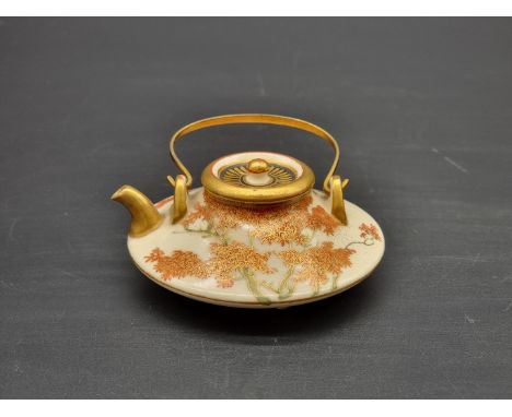 A miniature Japanese Satsuma pottery teapot and cover, signed Senzan, height including swing handle 6cm.