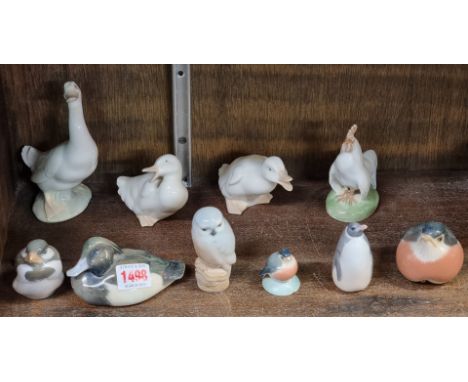 Seven Royal Copenhagen birds, largest 10.5cm high, (chip to beak of smallest); together with three Nao geese, largest 14.5cm 