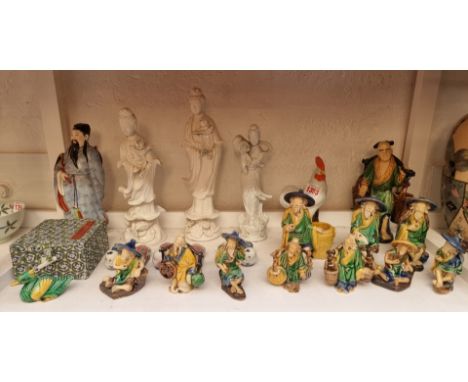 A collection of Chinese and Japanese ceramic figures. 