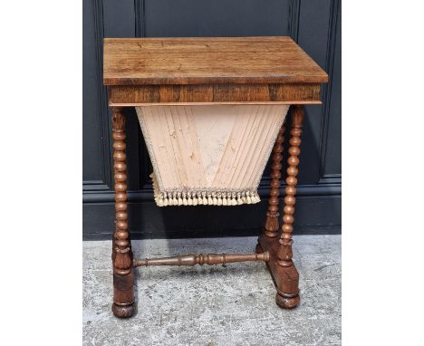 A 19th century rosewood work table, with bobbin turned supports, 54cm wide.