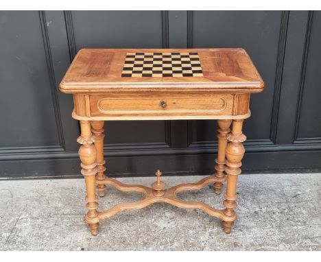 A late 19th century continental walnut and chequerboard inlaid fold-over card table, 79cm wide.