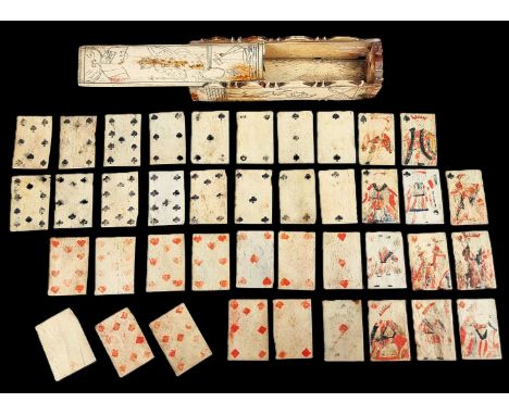 A rare Napoleonic Prisoner-of-War carved and stained bone cased part set of playing cards, the sliding lid decorated with a p