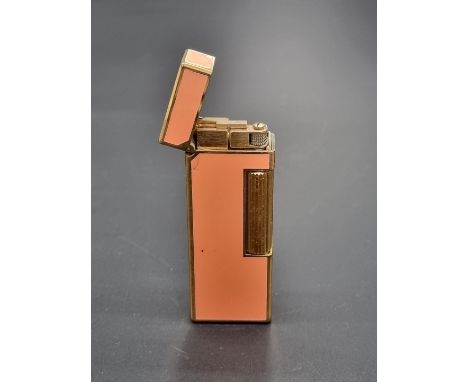 A Dunhill peach lacquer and gold plated lighter, 6.4cm.