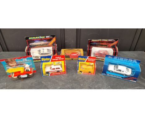 Dinky: a circa 1979 'Police Range Rover', No.254; together with a similar 'Bedford AA Van', No.412; two Scalextric vehicles; 