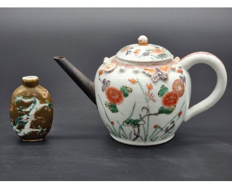 A Chinese Imari teapot and cover, with applied relief decoration and metal spout, 10cm high; together with a brown glazed snu