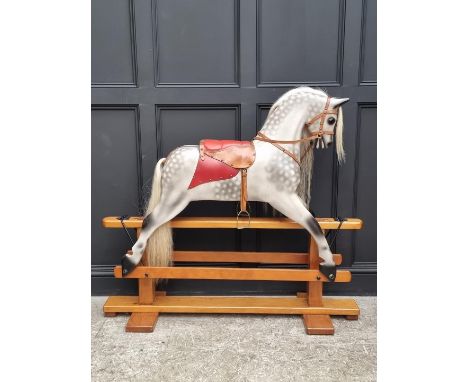 A large dapple grey rocking horse, 128cm high x 145cm long.