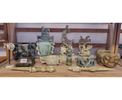 A collection of Chinese Archaistic style jade and soapstone carvings, largest 23.5cm high. (12)