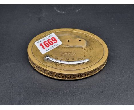 An antique gilt brass thermometer paperweight, with mahogany base, 10.5cm wide.